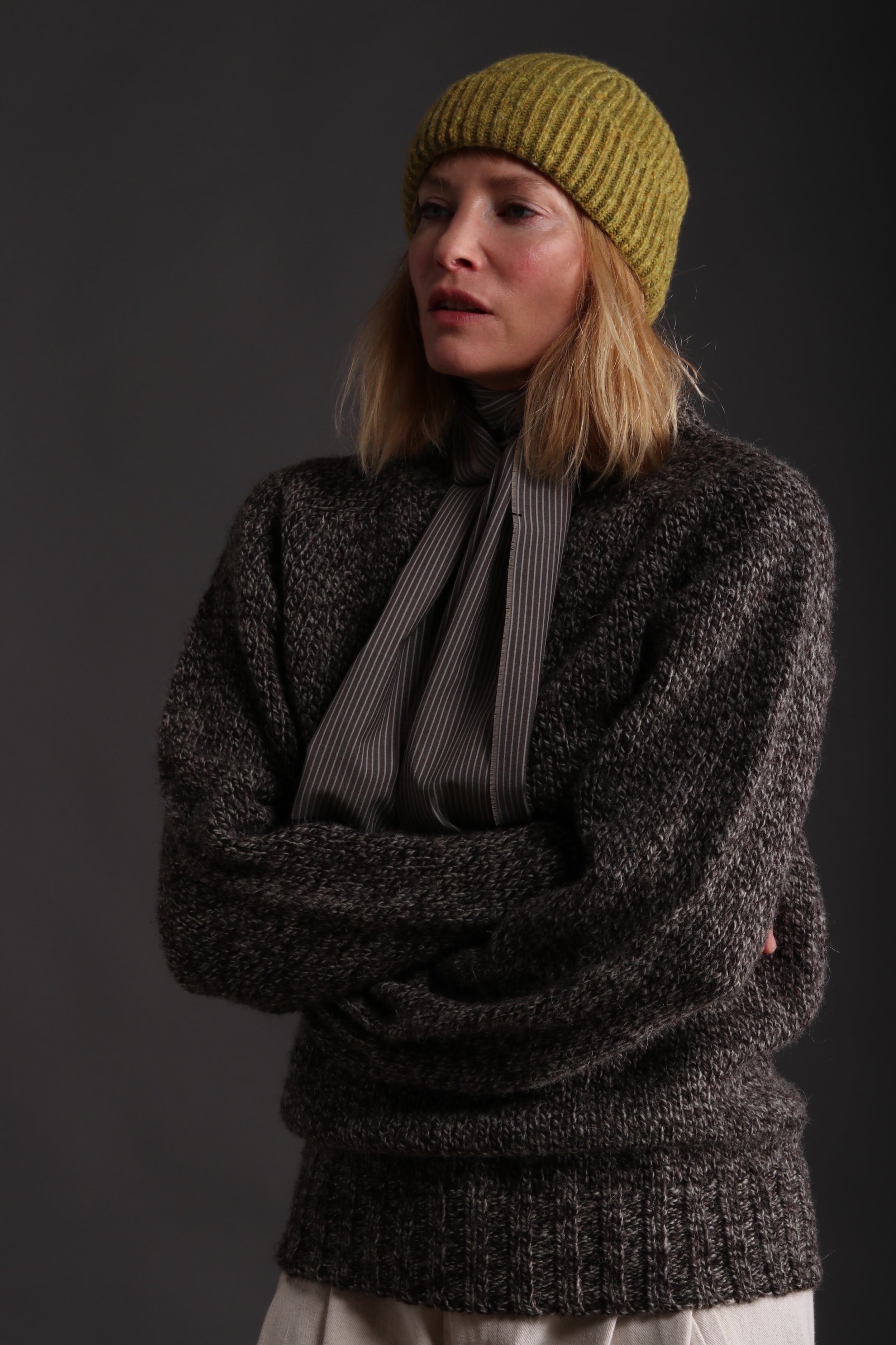 Woman wears Carrier Company Heavy Heritage Breed Lambswool Jumper with Donegal Wool Hat and Dutch Trouser in Seeded Denim