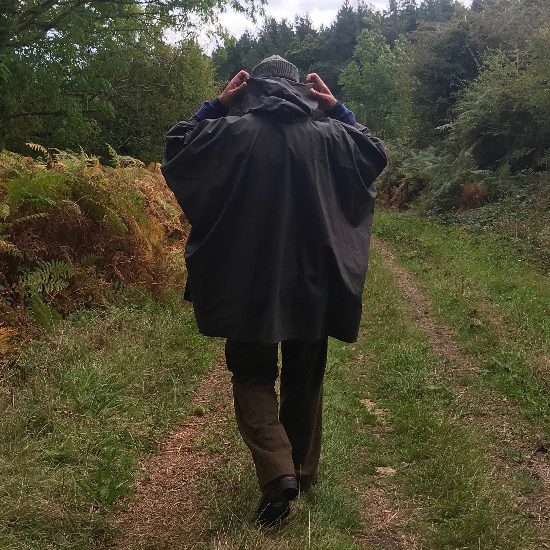 Man wearing Carrier Company Rain Cape