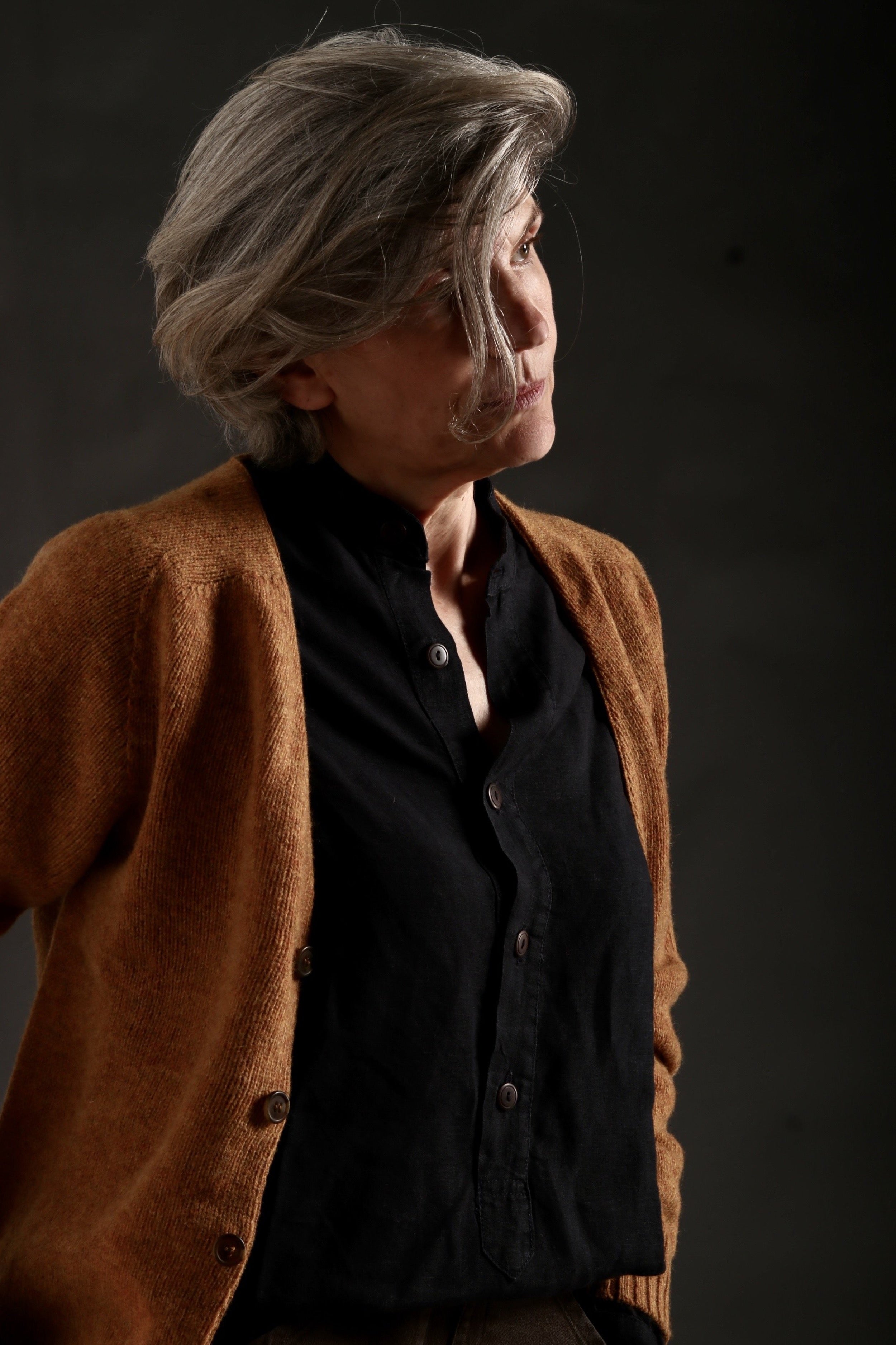Woman Wears V Neck Button Down Cardigan in Cumin and Women's Work Trouser in Olive