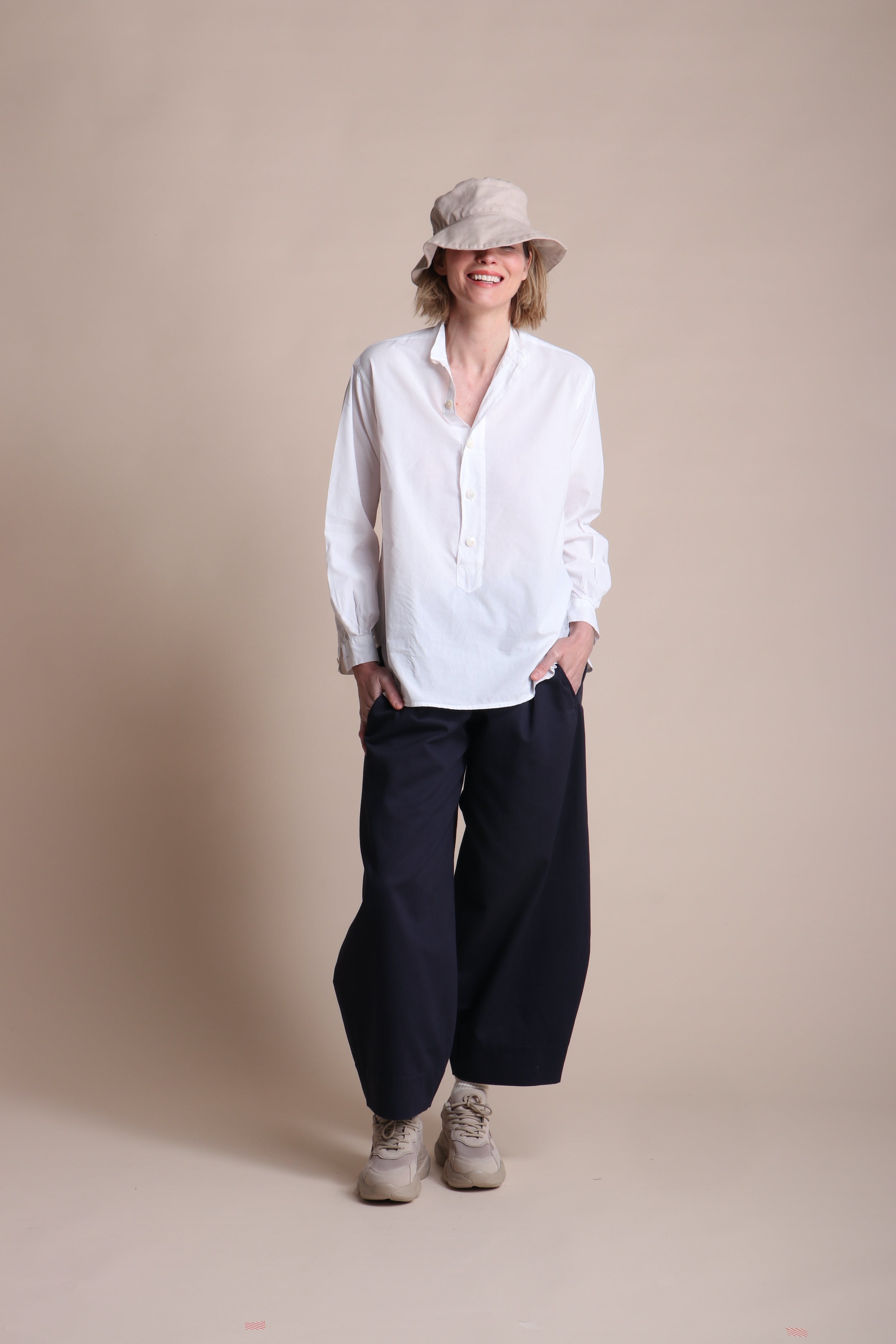 Woman weraing Carrier Company Dutch trouser In Navy Cotton Drill  and Lightweight Collarless Shirt
