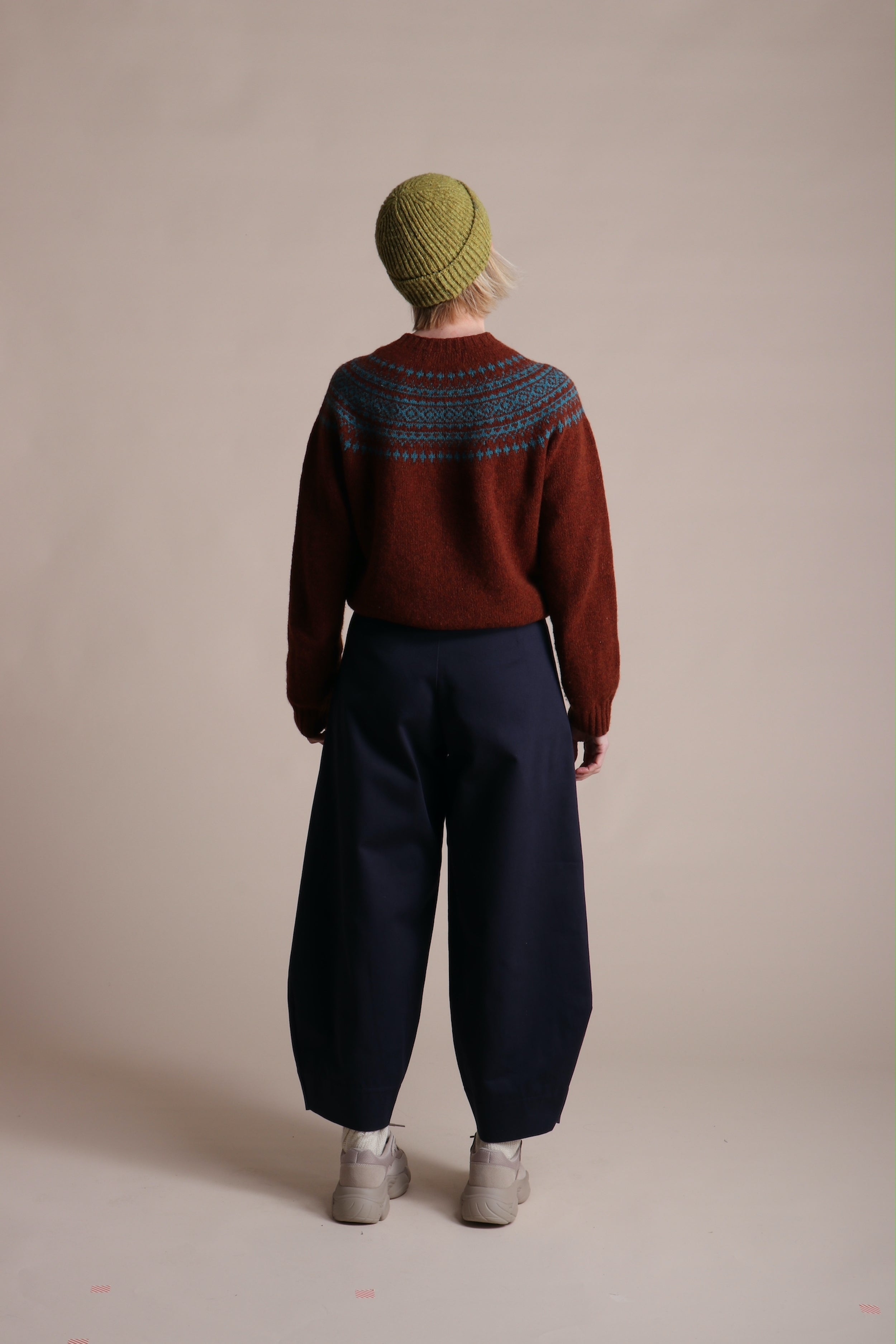 Woman wearing Carrier Company Dutch trouser In Navy Cotton Drill, Shetland Yoke Jumper and Merino Wool Hat