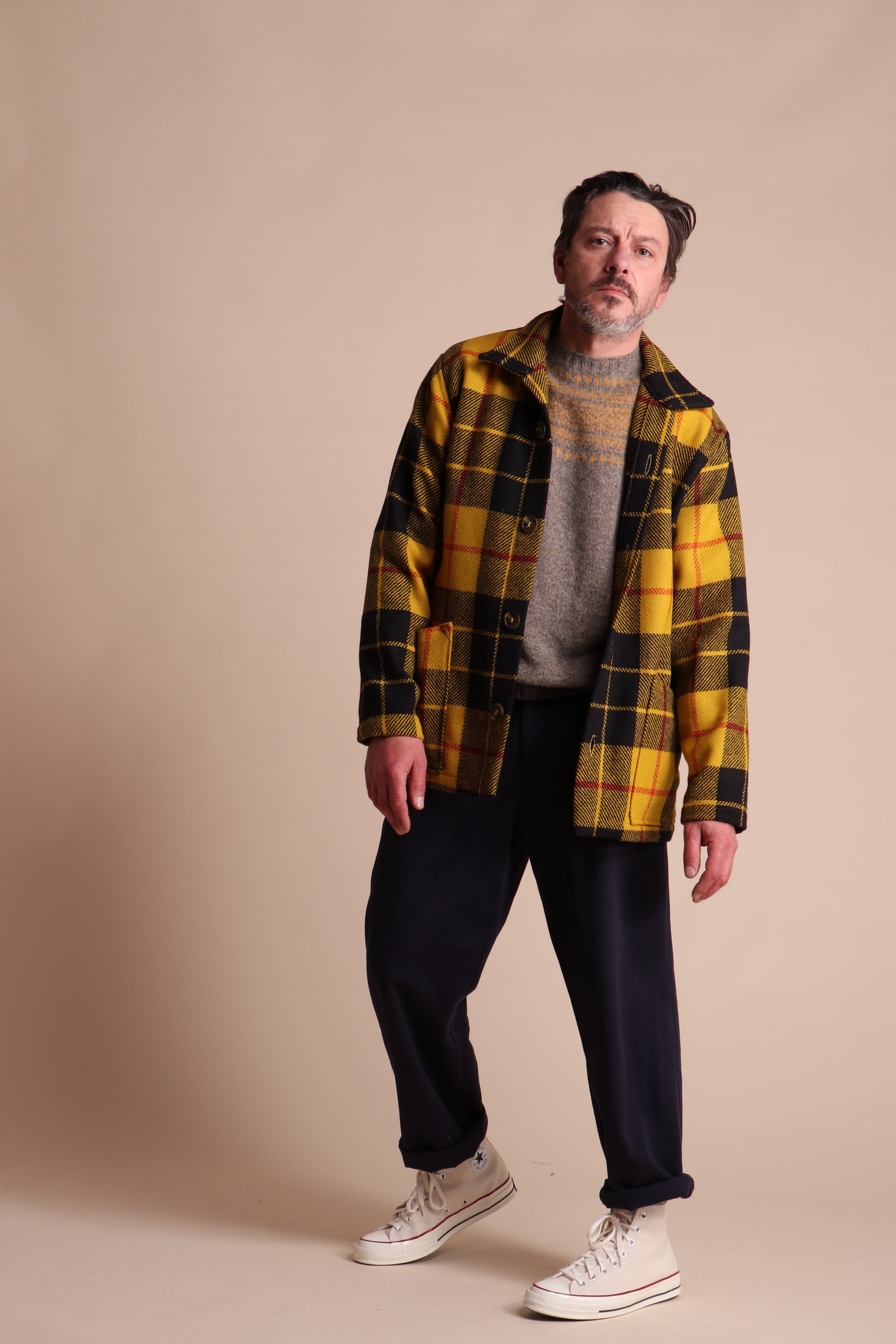 Man wearing Carrier Company Celtic Wool Jacket in Black and Yellow Check with Shetland Wool Yoke Jumper and Classic Trouser