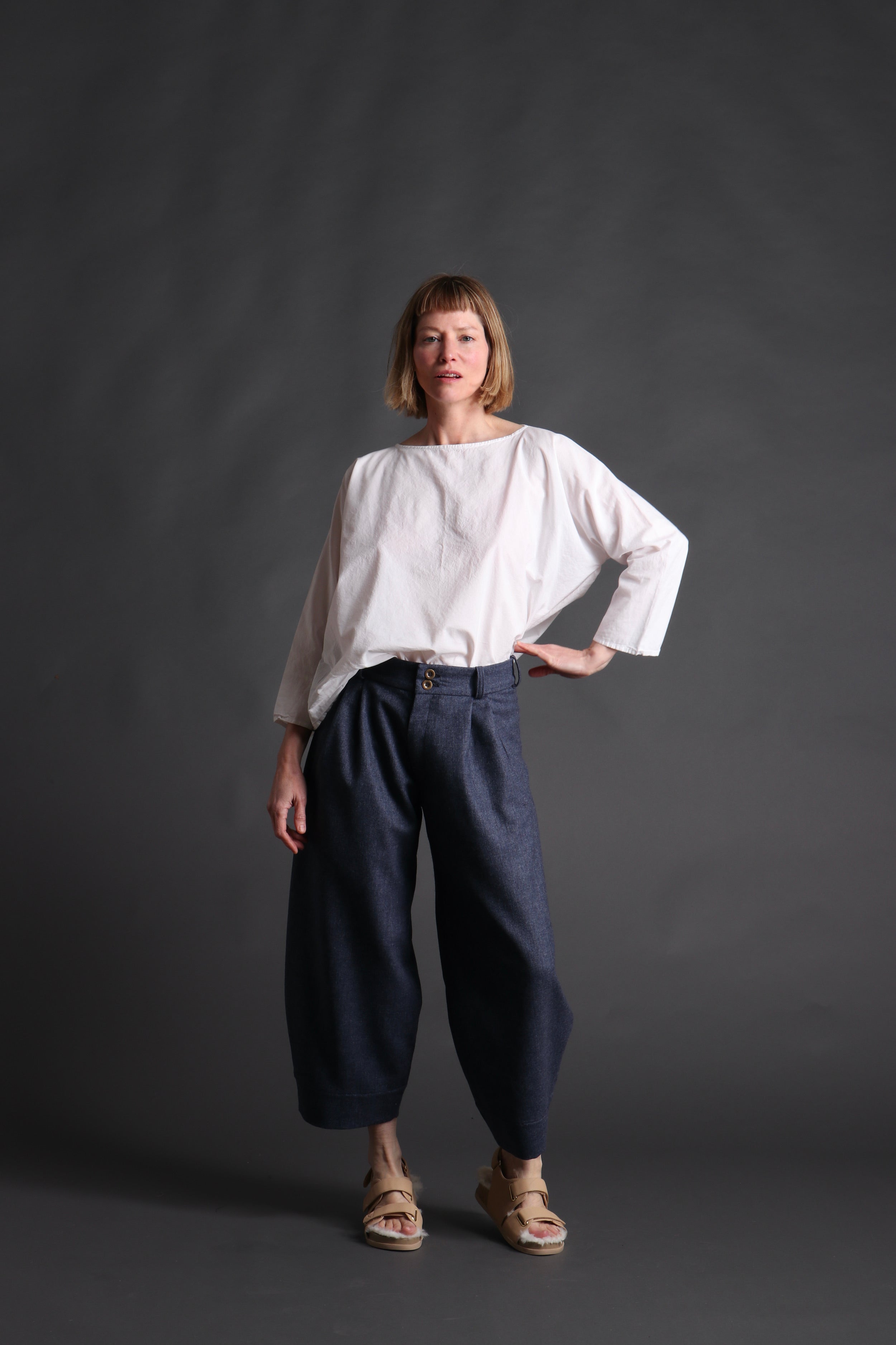 Woman wears Dutch Trouser in Navy Wool with Cotton Tee Shirt