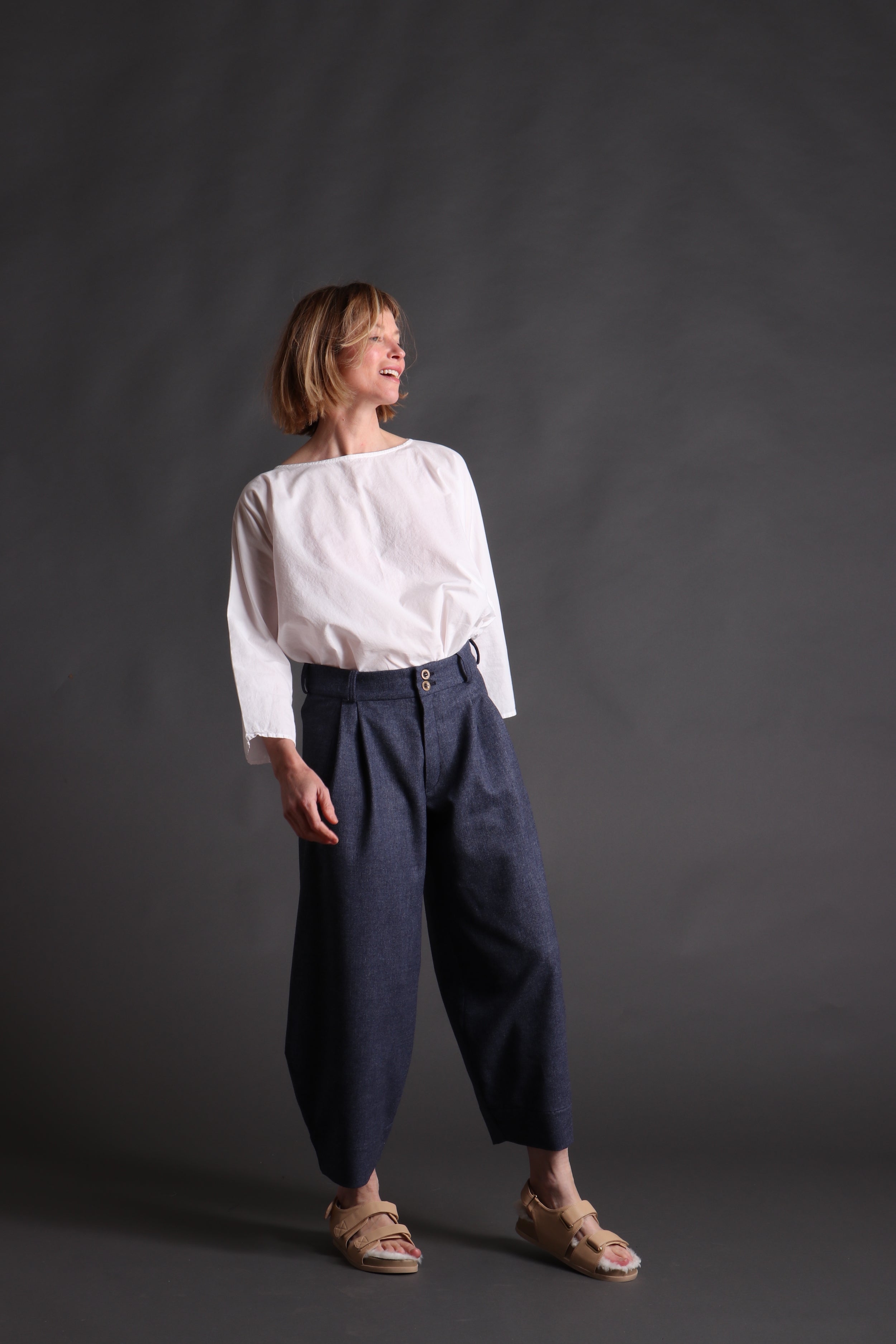 Woman wears Dutch Trouser in Navy Wool with Cotton Tee Shirt