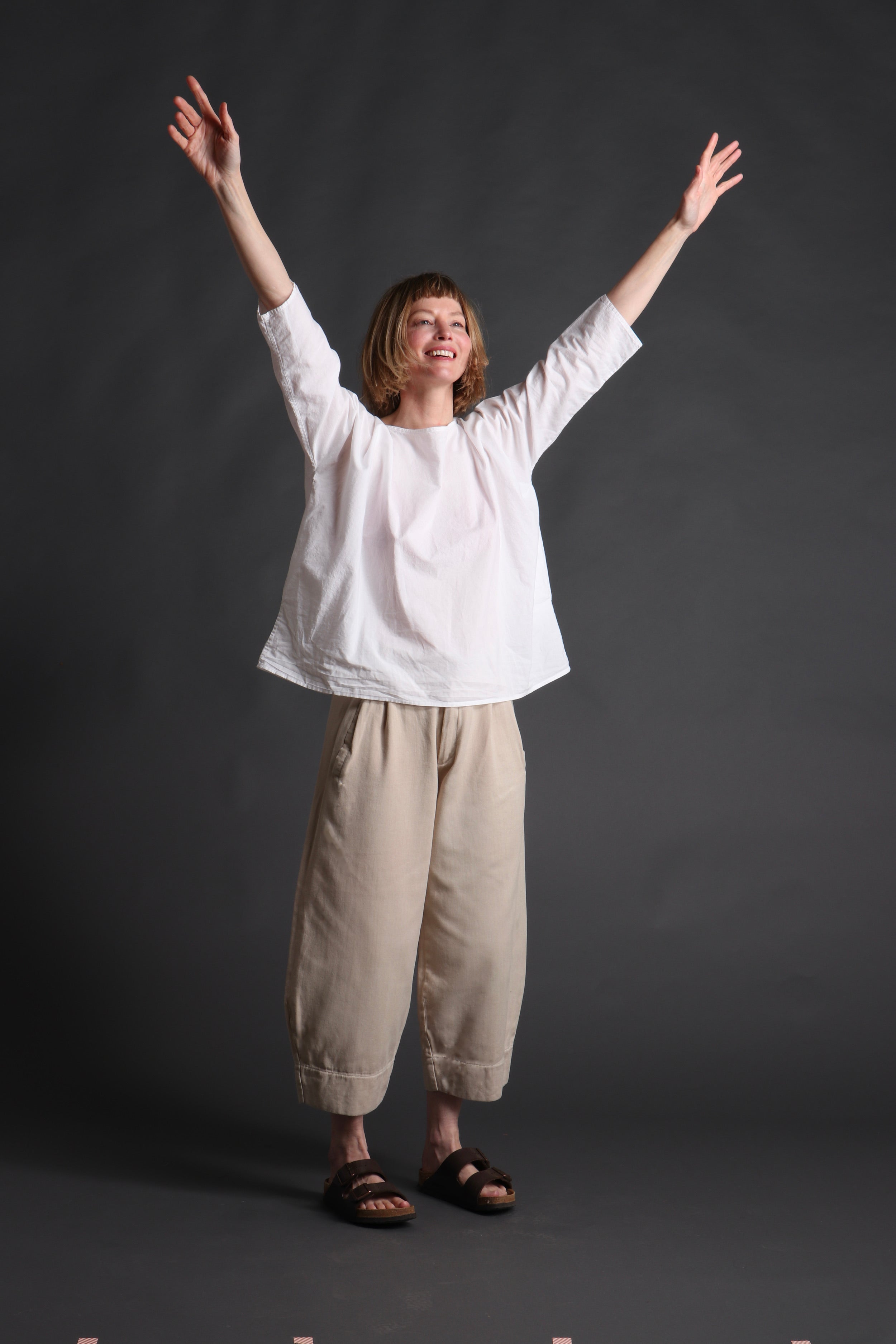 Woman wears Carrier Company White Cotton Tee Shirt with Dutch trouser