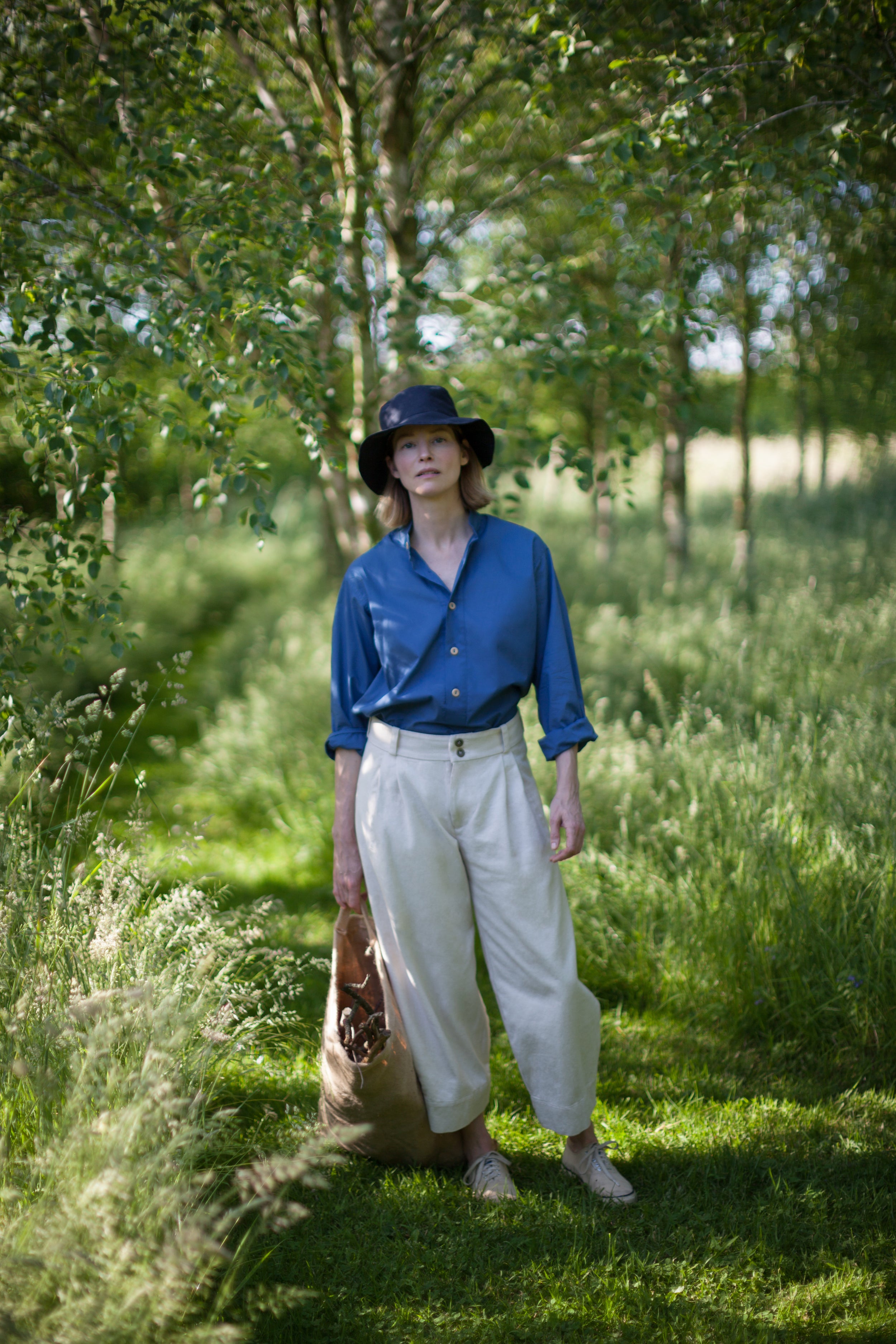 Woman wears Carrier Company Dutch Trouser in Seeded Denim