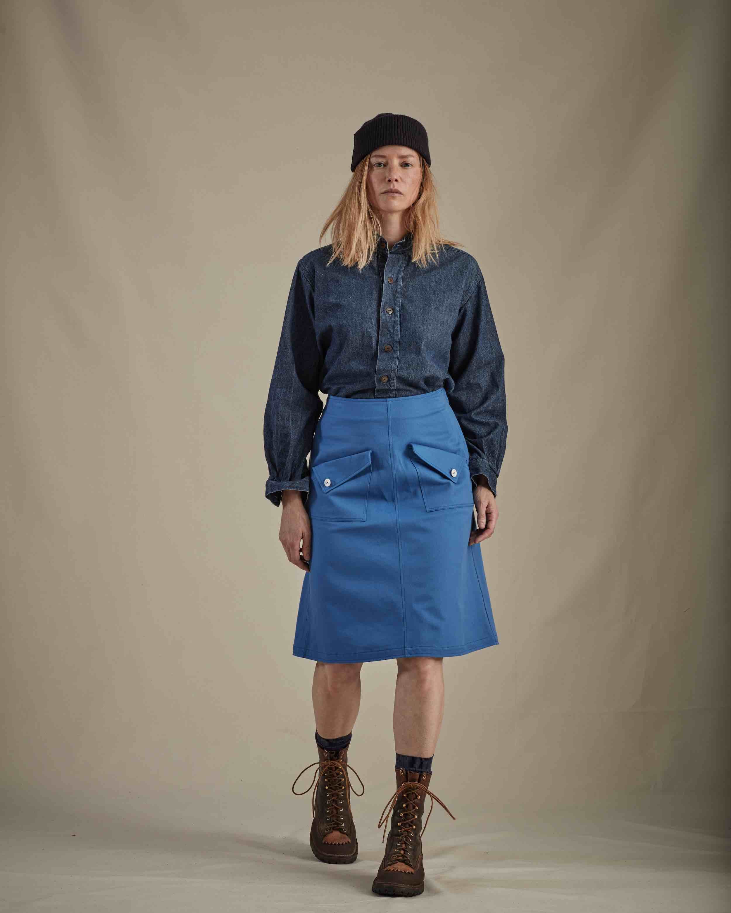 Woman wearing Carrier Company Denim Work Shirt and sky Blue Mum Skirt and Navy Wool Hat