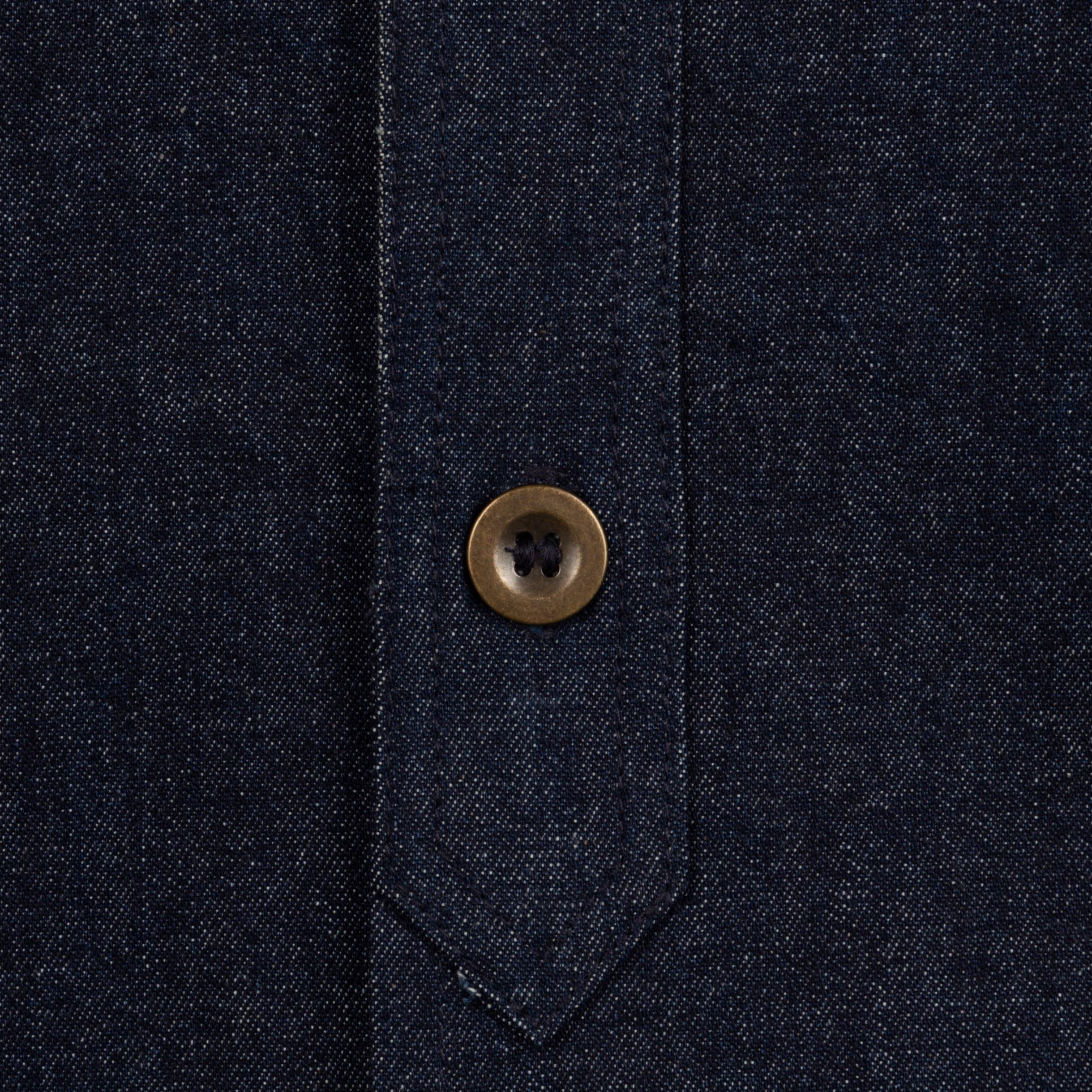 Close up of the button detail of the Carrier Company Denim Collar Shirt