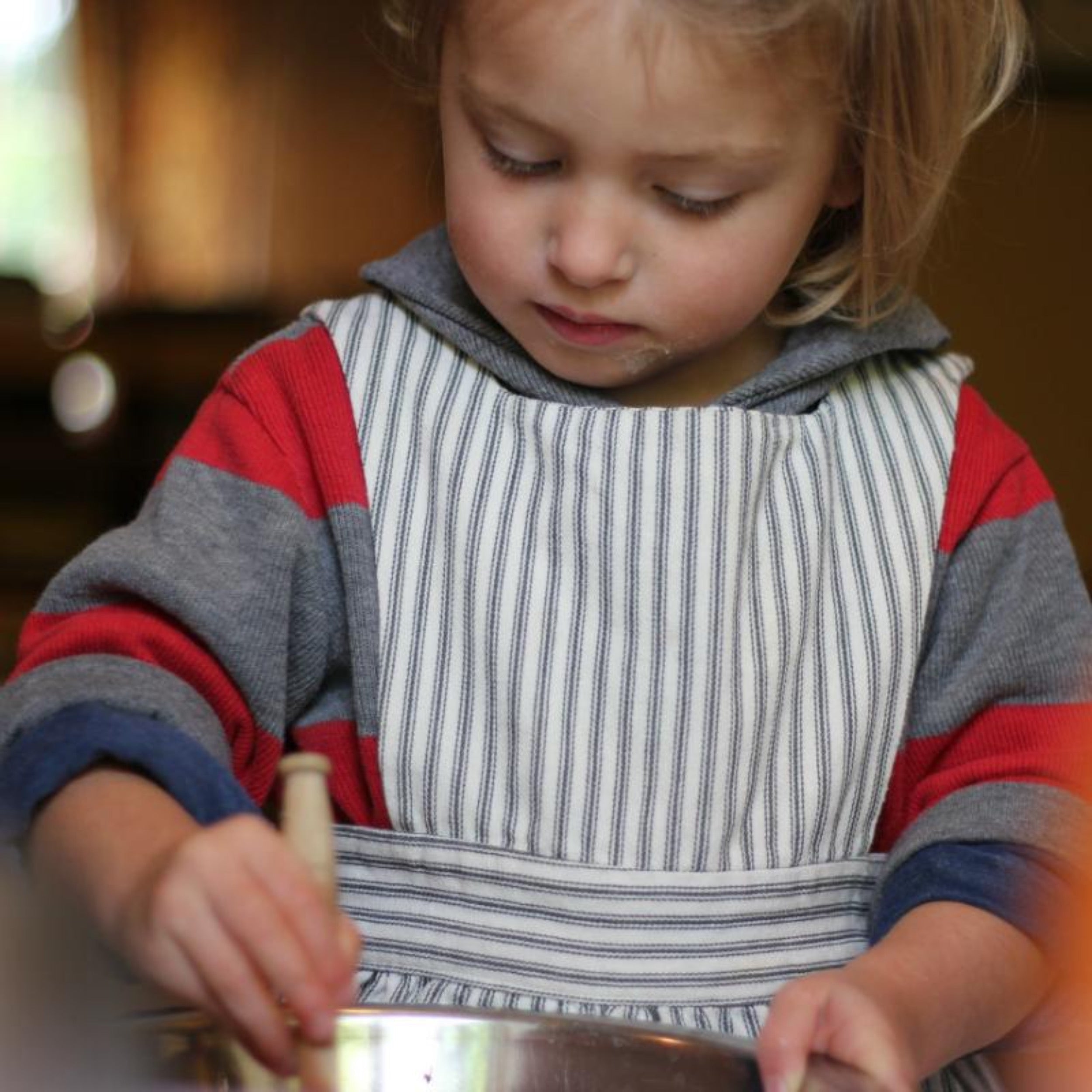 Little Girls Wears Carrier Company Child's Pinafore in Indigo Ticking