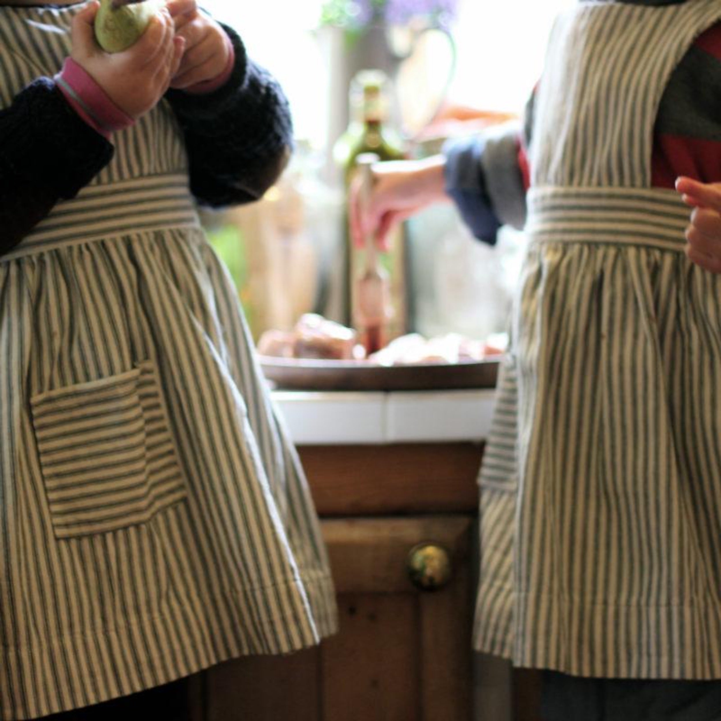 Toddlers wear Carrier Company Child's Pinafore in Indigo Ticking