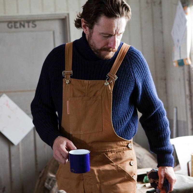 Man Wearing Carrier Company Tan Dungarees with Navy Fisherman Jumper