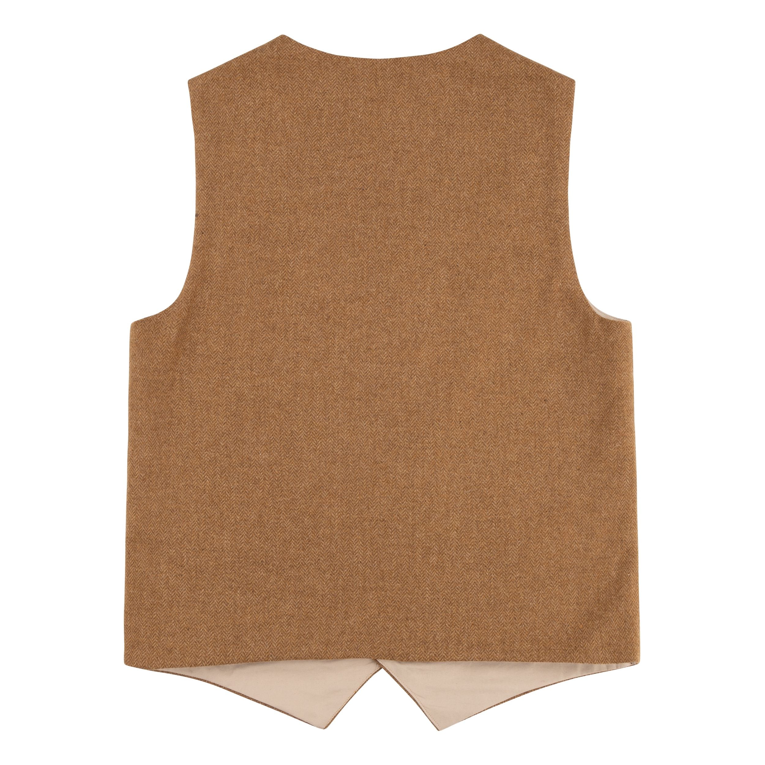 The back of the Carrier Company Men's Wool Waistcoat in Ginger Herringbone